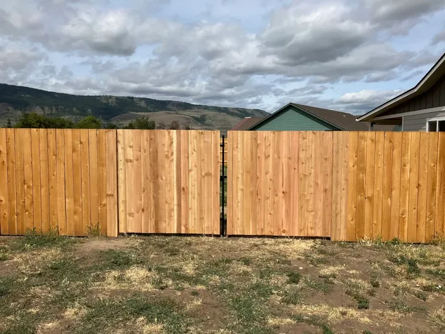 New cedar privacy fence against an Eastern Oregon mountain view